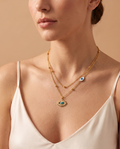 Eternal Flame Necklace, gold-tone evil eye necklace worn on model | Eternal Flame ketting, goudkleurige boze-oog ketting gedragen door model