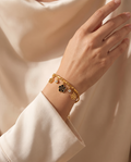 Pure Radiance Bracelet, gold-tone, worn on the wrist | Pure Radiance armband, goudkleurig, gedragen om de pols