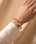 Sweet Whisper Bracelet, gold-tone, worn on the wrist | Sweet Whisper armband, goudkleurig, gedragen om de pols