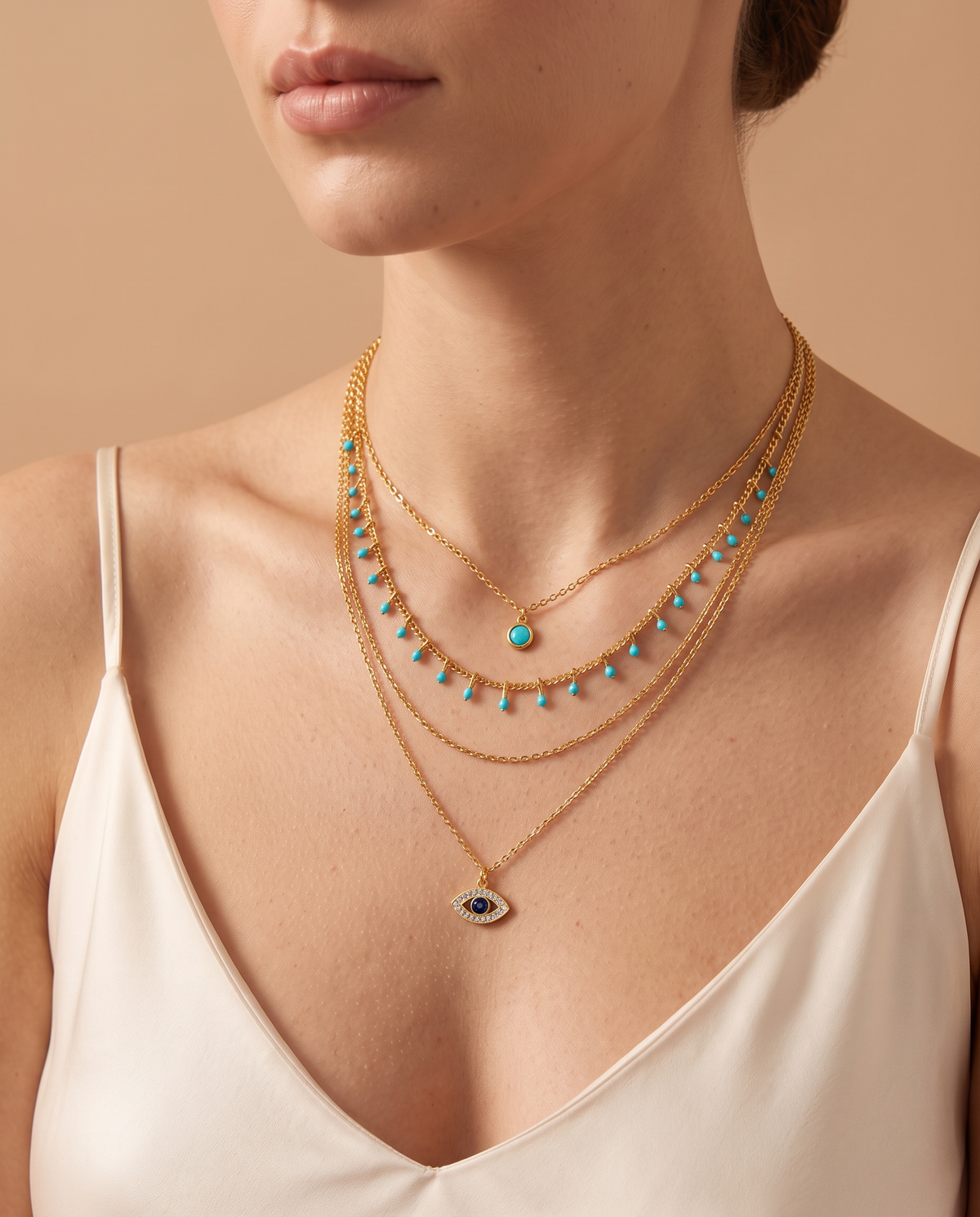 Velvet Grace Necklace, four fine layers with turquoise-coloured beads and a small eye pendant | Velvet Grace ketting, vier fijne lagen met turquoisekleurige kraaltjes en een klein oog-hangertje