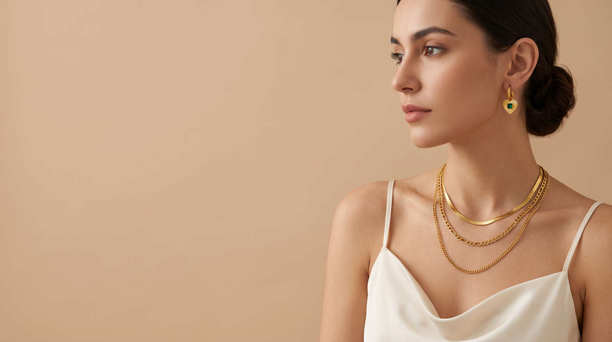 OSO Jewelry – model wearing gold-tone layered necklaces and heart earrings